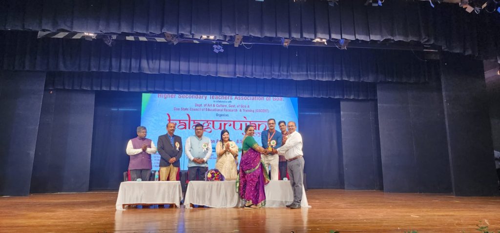 Principal Sir And Manisha tr Recieving Prize for Singing Competition.