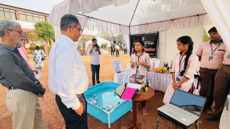 Students giving Impressive Explanation of Aqua -Defender to Director of Education Goa Shri.  Shailesh R. Sinai Zingde at 34th Western Indi Science Fair 2025.